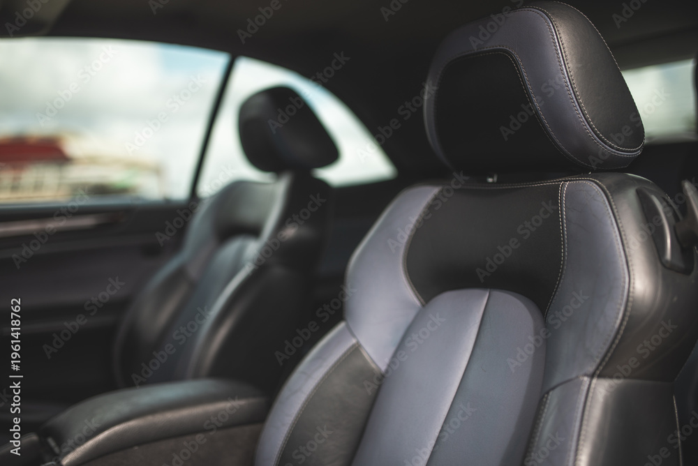 Obraz premium Luxurious car interior with comfortable leather seats and a modern design