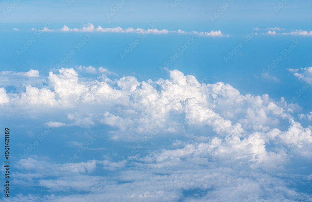 Fototapeta premium Blue Sky with White Clouds, Flying above Sunny Cloudy Sky Texture Pattern Plane View