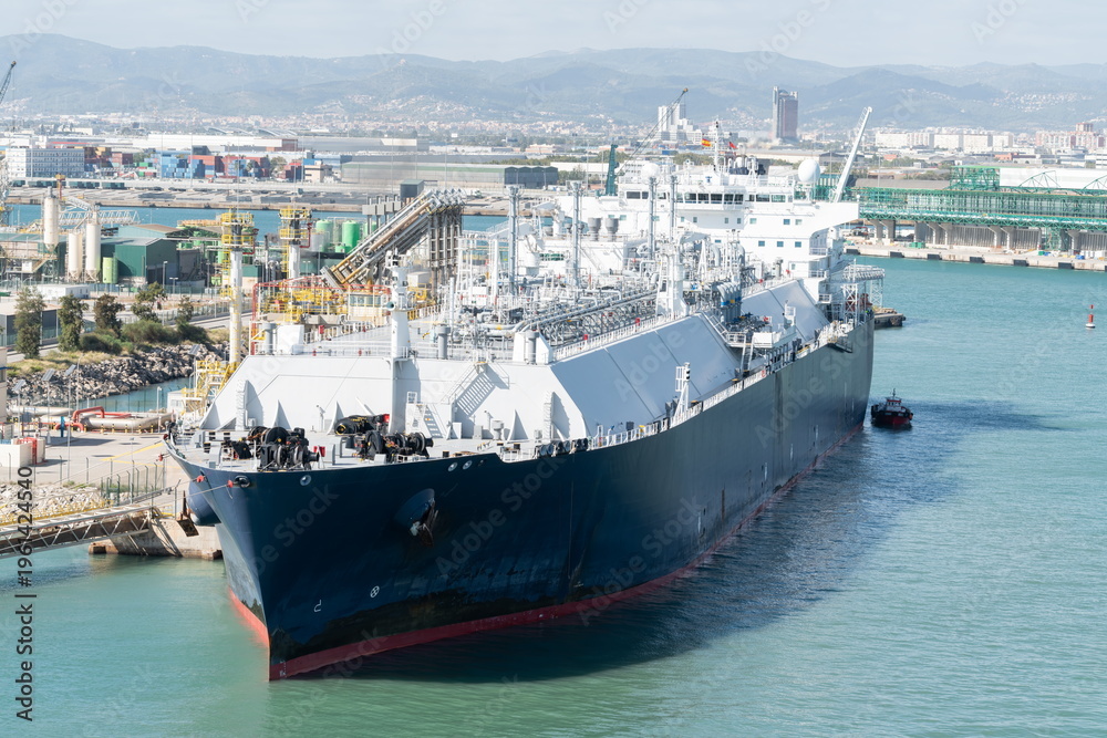 Naklejka premium LNG tanker at industrial port terminal. Barcelona, Spain