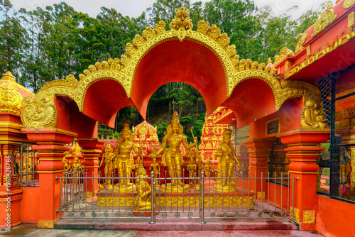 Golden statues at Sriramajayam Hindu Temple in Nuwara Sri Lanka showcase intricate designs and cultural significance in a vibrant setting