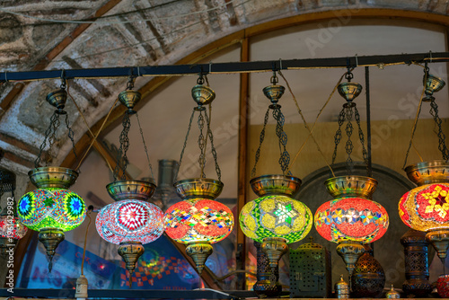 Colorful mosaic lamp chandeliers hanging in a bazaar market in Izmir, Turkey