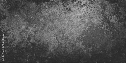 Aged dark grunge texture with a rough black and white concrete wall pattern and vintage dirty gray stone surface material for a moody wallpaper backdrop