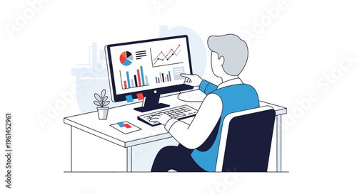 Concentrated man analyzing data on a desktop computer at a modern office desk in a bright studio.