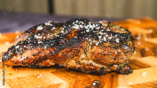 Schilderij op canvas Juicy roasted boneless lamb joint with a crispy seasoned crust and tender interior