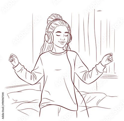 Young woman dancing and enjoying music while listening with headphones  