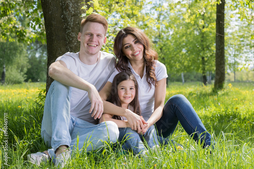 A very happy family on the green grass