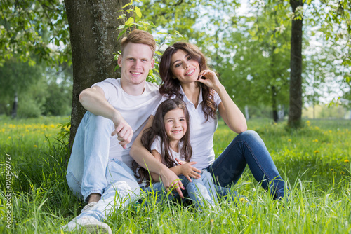 A very happy family on the green grass
