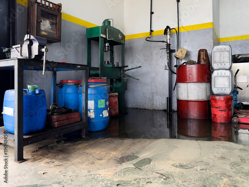 industrial workshop with oil spill on floor
