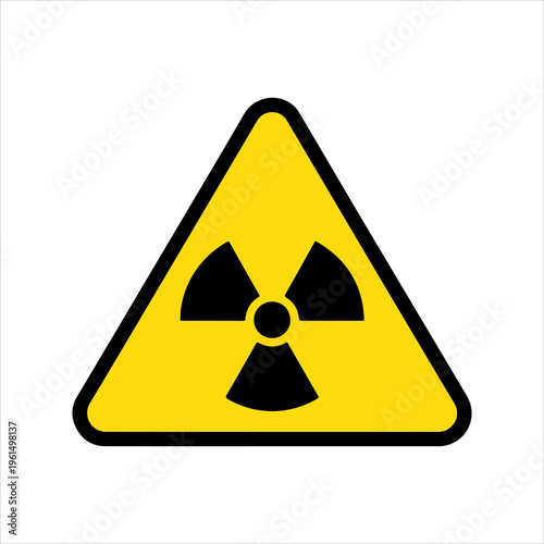 Yellow triangular radiation warning sign with black symbol.