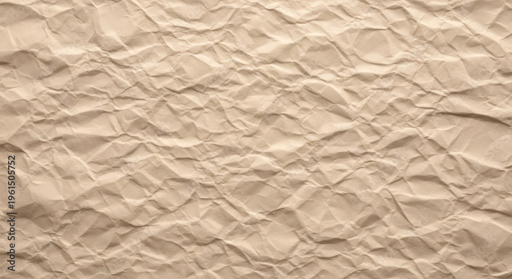 Obraz premium Textured crumpled beige paper background with