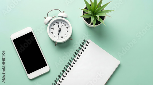 Wallpaper Mural Morning routine, smartphone, alarm clock and notebook on green background Torontodigital.ca