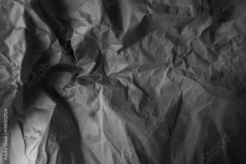 Creased black paper texture background 