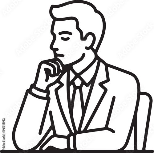 Thoughtful businessman sitting at a table with hand on chin.