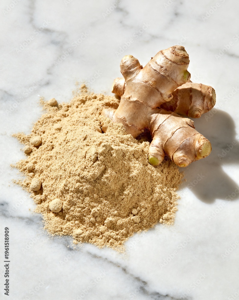 Fototapeta premium Fresh Ginger Root and Powder on Marble Surface, Spice Ingredient