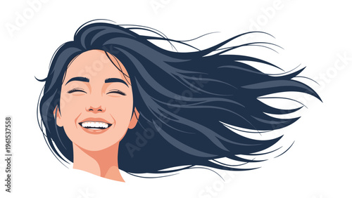 Happy young woman with long dark hair blowing in the wind smiling with her eyes closed against a white background.