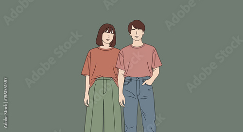 Two young adults standing together smiling.