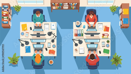 Top down aerial view of four people working at their organized desks with computers, documents, and plants in a modern office space.
