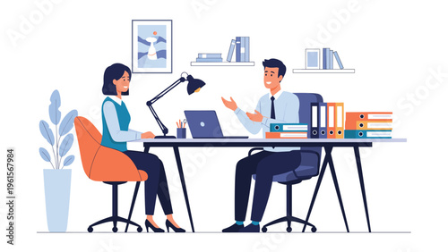 Two professional business colleagues having an engaging discussion across a desk with a laptop and folders in a modern bright office.