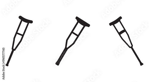Three black crutches with handles and leg supports in different positions on white background for medical aid and rehabilitation needs