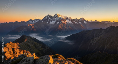 Snowy mountain peak at sunrise.