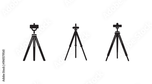 Three black tripods with smartphone holders on white background for photography and videography support