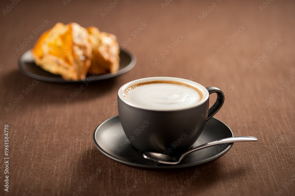 Fototapeta premium Homemade Caffe Latte with Rich Milk Foam and Freshly Baked Scones