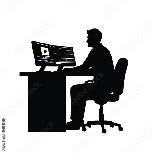 Video Editor Working at Desk Silhouette