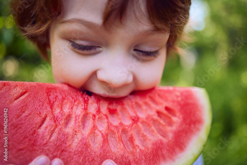 Wallpaper Mural Close-Up of Child Eating Fresh Watermelon – Juicy Summer Snack, Healthy Lifestyle and Childhood Joy Torontodigital.ca