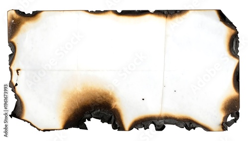 Close-up of a singed paper rectangle with burnt edges against a white background