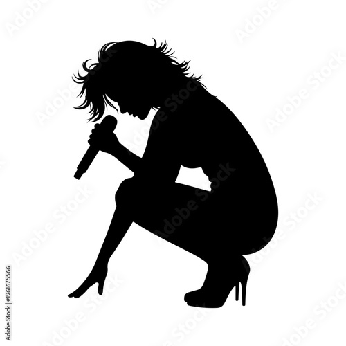 Tableau sur toile Silhouette of a female singer performing with a microphone.