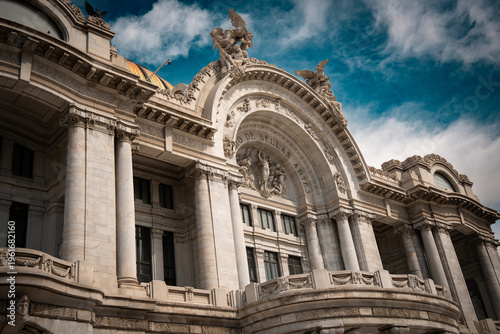Palacio de Bellas Artes facade with blue sky and detailed architecture in Mexico City
