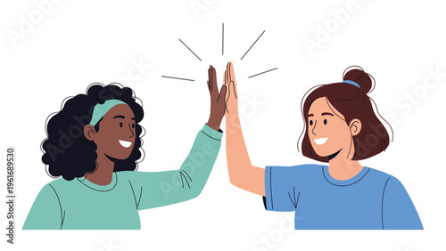 Two diverse female friends share a joyful moment and celebrate their success by giving each other an enthusiastic high five.