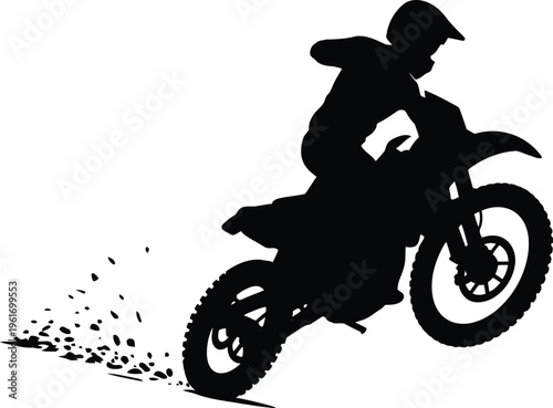 A dynamic silhouette captures a motocross rider performing a wheelie on a dirt bike