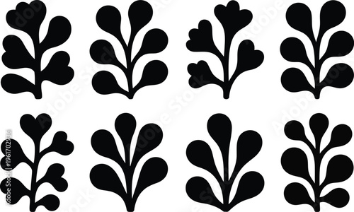 An appealing array of eight black silhouette stylized leaf designs stands out against a white surface