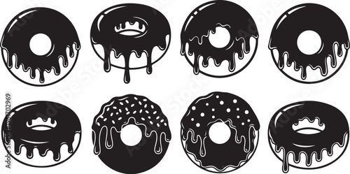 Set of black frosted donuts with decorations and toppings