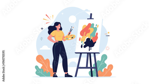 Talented female artist standing in her studio while painting a colorful abstract masterpiece on a large canvas and easel.