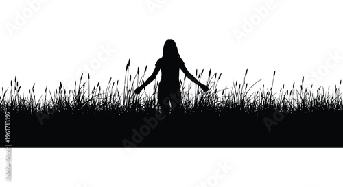 Woman stands in tall grass with arms outstretched a dark silhouette
