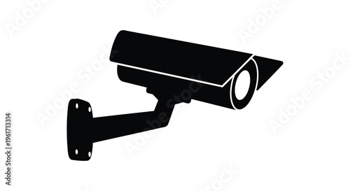 Black security camera on a white wall a stark silhouette