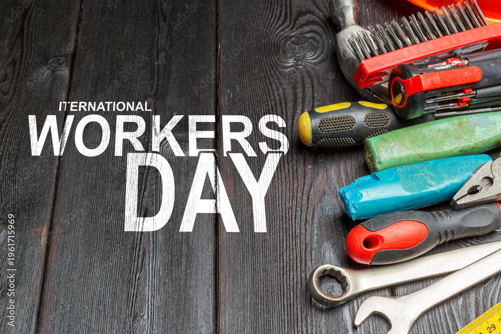 Obraz premium Celebration of International Workers Day on May 1 with tools and equipment on a table
