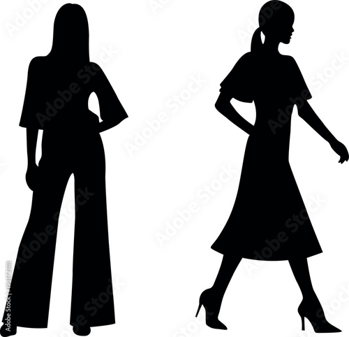 Two fashionable women in silhouette posing with hands on hips