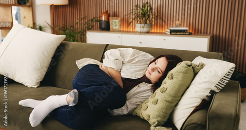 Fotografie Rest, menstruation and woman on couch with ibs, discomfort and stomach ache with symptoms