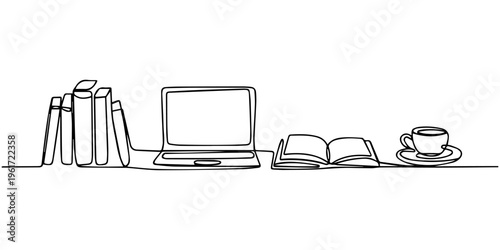 Young man sitting on a chair using a laptop computer and reading with technology devices like laptop phone tablet and monitor around him