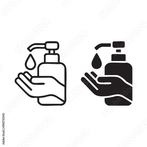 Hands receiving liquid soap from pump bottles in a cleaning action with hygiene products and sanitizer.