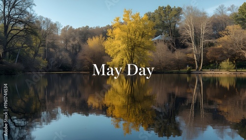 A serene lake surrounded by trees with yellow leaves on a clear day