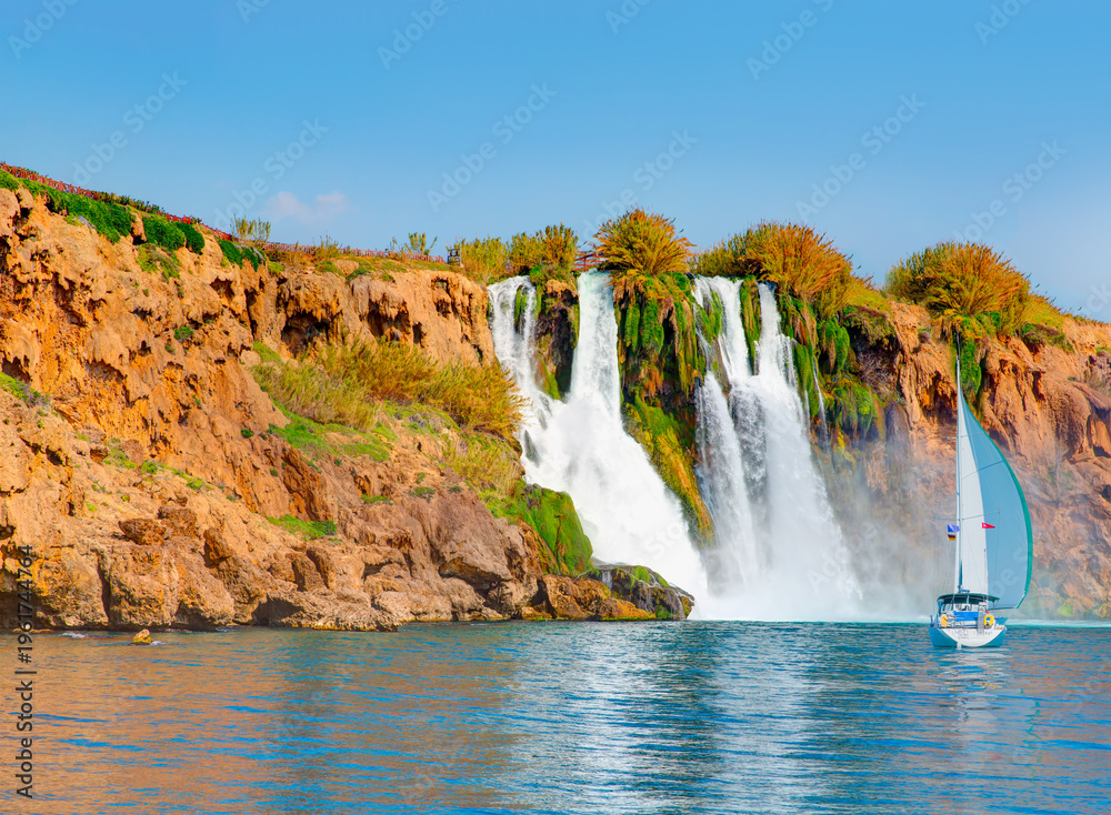 Naklejka premium Powerful upper Düden waterfall, a water stream breaks from a high cliff - Antalya, Turkey