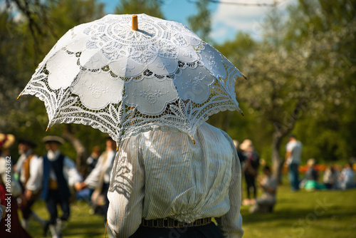 Woman with an umbrella, ancient traditions in Lithuania
