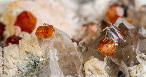 Natural Spessartine Garnet Crystals in Matrix Isolated on White