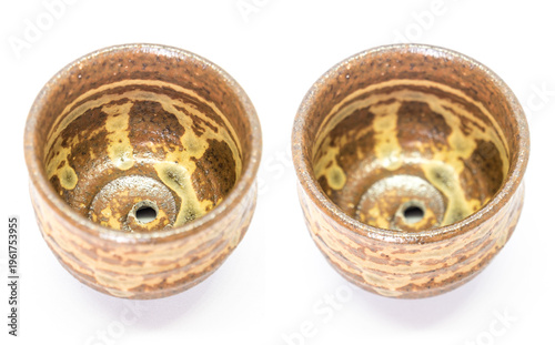 The ceramic cup has been adapted for planting small pot plants