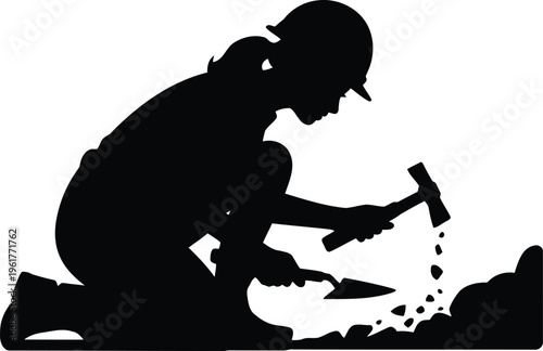 Silhouette depicting a female archeologist squatting down to carefully excavate using a hammer and trowel