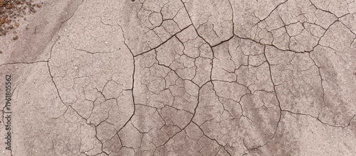 Cuadro en lienzo Top view of dry cracked soil texture in arid land